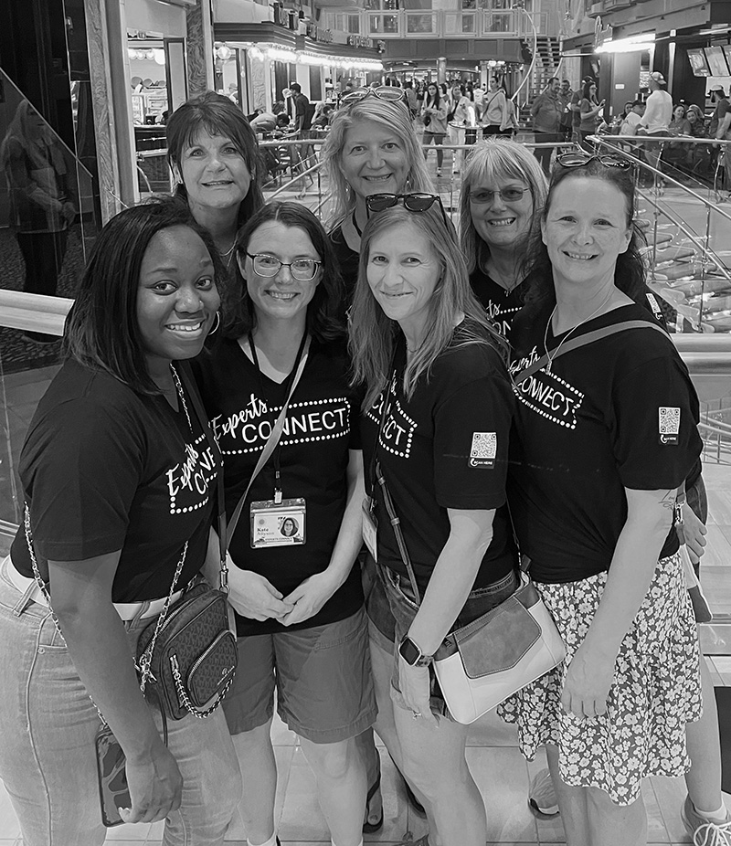 Laurie Baines collaborating with team on business growth strategy